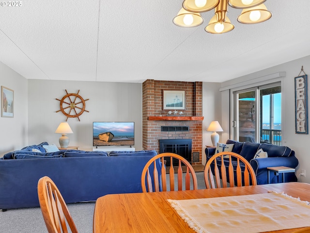 1146 N Marion Ave Unit 628, Gearhart, OR 97138 - carpeted dining room with a textured ceiling and a brick fireplace