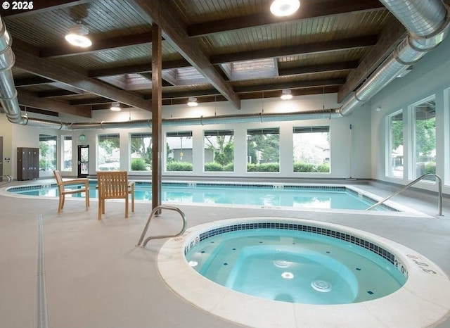 pool with an indoor in ground hot tub