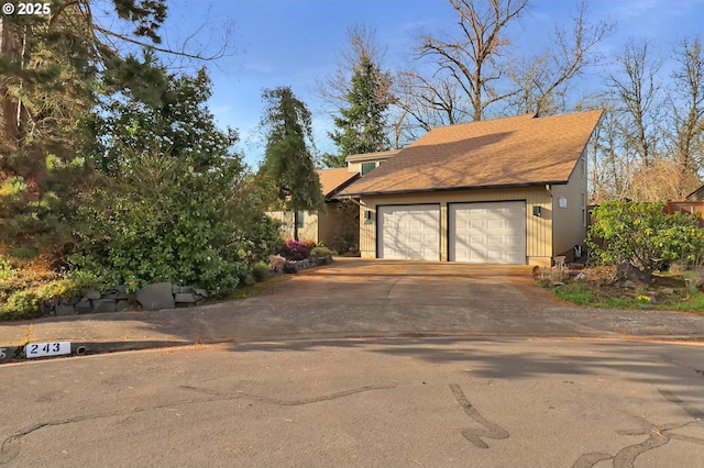 garage featuring driveway