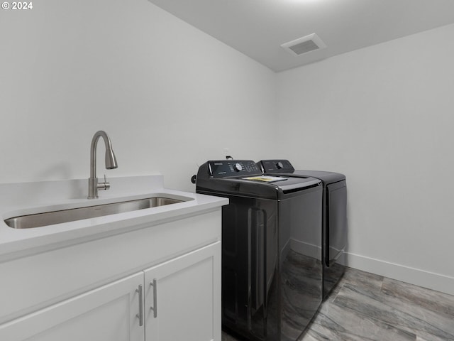 1790 Thompson Falls Dr, Seaside, OR 97138 - washroom featuring separate washer and dryer and cabinet space