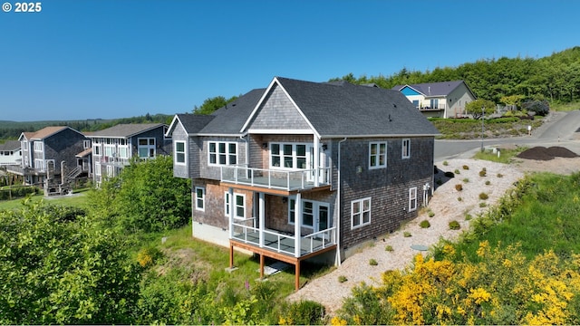 1790 Thompson Falls Dr, Seaside, OR 97138 - rear view of house featuring a balcony and roof with shingles