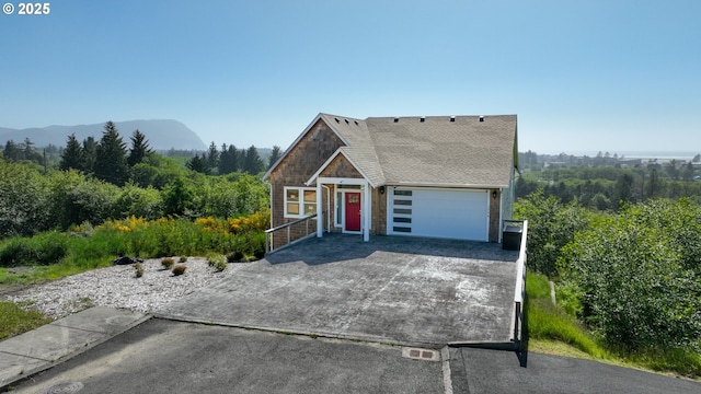 1790 Thompson Falls Dr, Seaside, OR 97138 - view of front of property with driveway, roof with shingles, and stone siding
