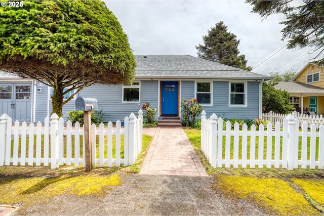 2385 S Downing St, Seaside, OR 97138 - bungalow featuring a fenced front yard and roof with shingles