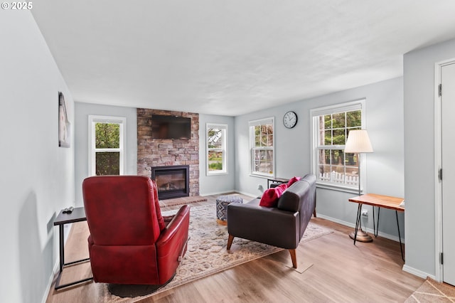 2385 S Downing St, Seaside, OR 97138 - living area featuring wood finished floors and a stone fireplace
