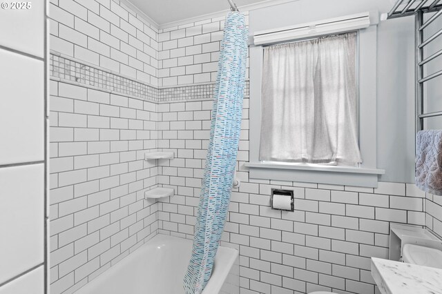2385 S Downing St, Seaside, OR 97138 - bathroom featuring shower / bathtub combination with curtain, tile walls, and vanity
