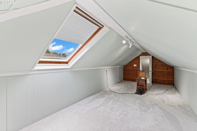 2385 S Downing St, Seaside, OR 97138 - additional living space with wooden walls, carpet, vaulted ceiling, and a skylight