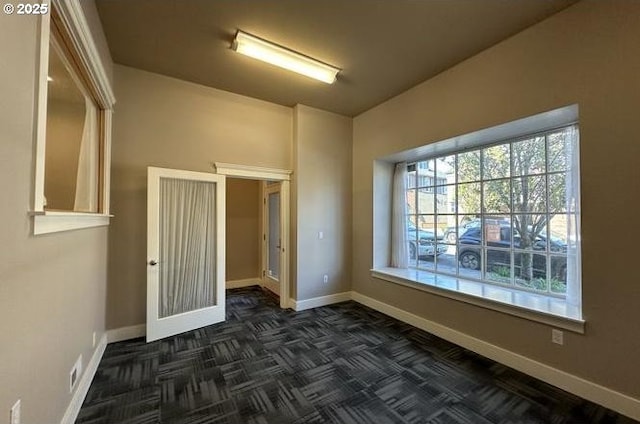 spare room with visible vents and baseboards