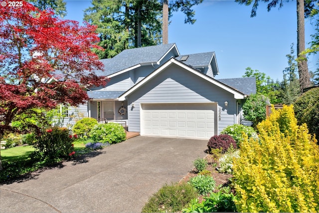 view of front of home with an attached garage, a shingled roof, and asphalt driveway