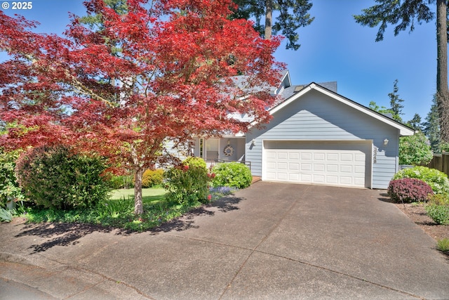 view of front of house featuring driveway and a garage