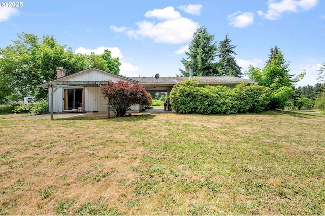 22224 S Kamrath Rd, Oregon City, OR 97045 - rear view of house featuring a yard and a chimney