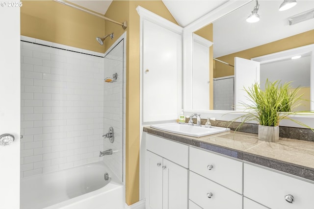 bathroom featuring shower / washtub combination and vanity