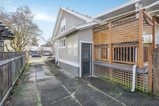 rear view of house with fence