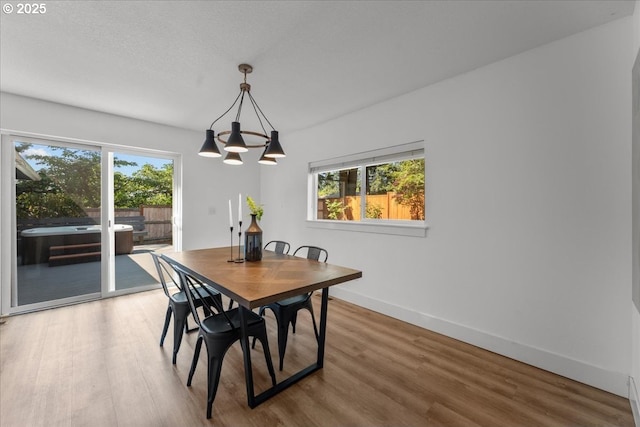 4992 Prospect St, West Linn, OR 97068 - dining room with a chandelier, healthy amount of natural light, and wood finished floors