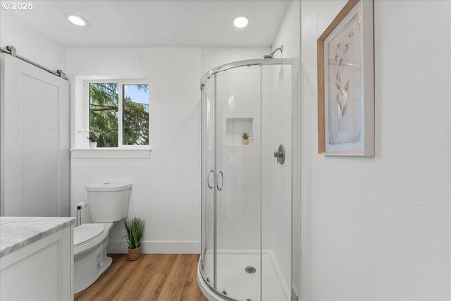 4992 Prospect St, West Linn, OR 97068 - bathroom with a shower stall, vanity, wood finished floors, and recessed lighting
