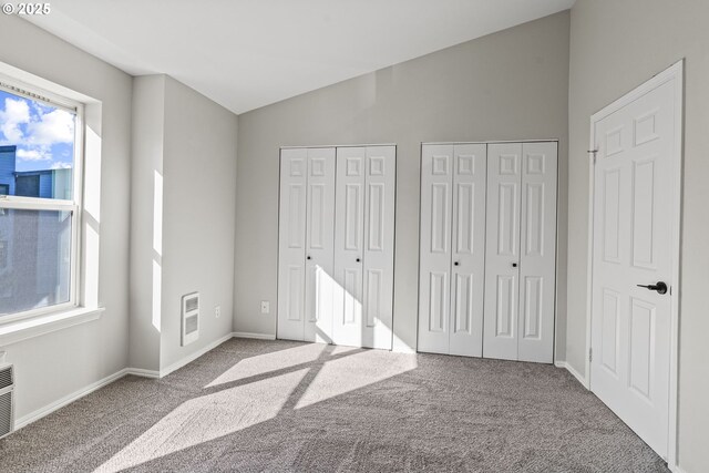 bathroom featuring vanity, wood finished floors, stacked washer / dryer, toilet, and  shower combination