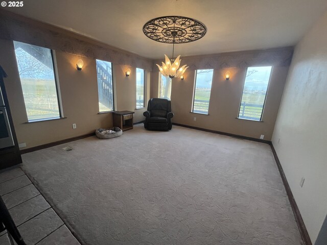 unfurnished living room featuring french doors, a stone fireplace, and baseboards