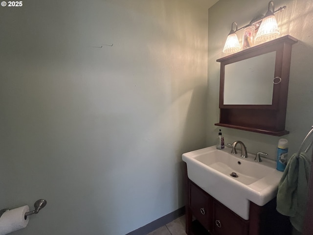 bathroom featuring tile patterned flooring and vanity