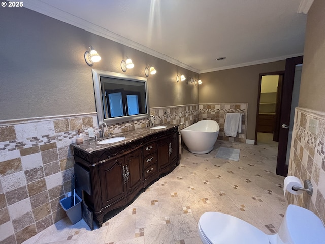 bathroom featuring a sink, tile walls, a soaking tub, and toilet