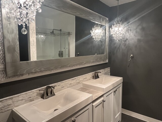 bathroom with tile patterned flooring, a sink, and a shower stall