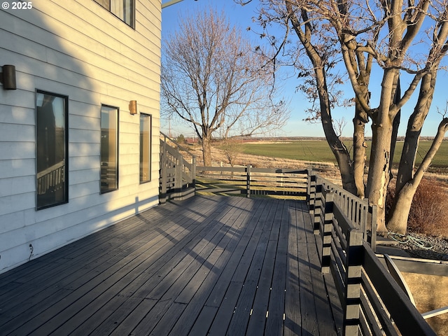 wooden terrace featuring a rural view