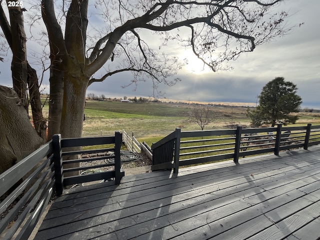 wooden deck with a rural view