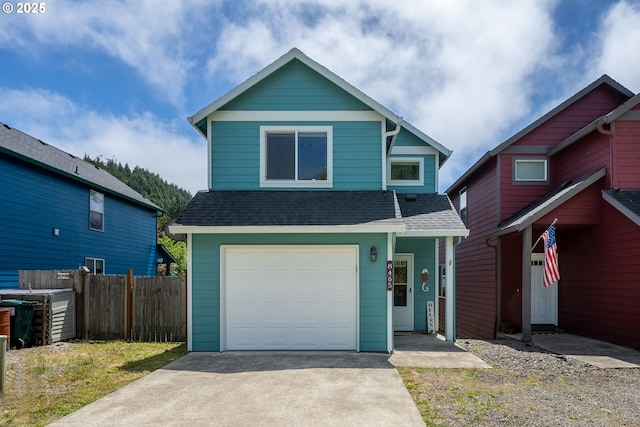 8465 S Hollyhock St, Rockaway Beach, OR 97136 - view of front facade featuring a shingled roof, an attached garage, and driveway