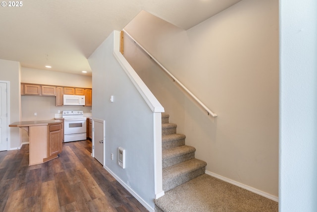 8465 S Hollyhock St, Rockaway Beach, OR 97136 - stairway with recessed lighting and wood finished floors