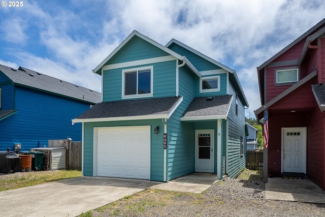 8465 S Hollyhock St, Rockaway Beach, OR 97136 - view of front of property with roof with shingles, concrete driveway, and an attached garage