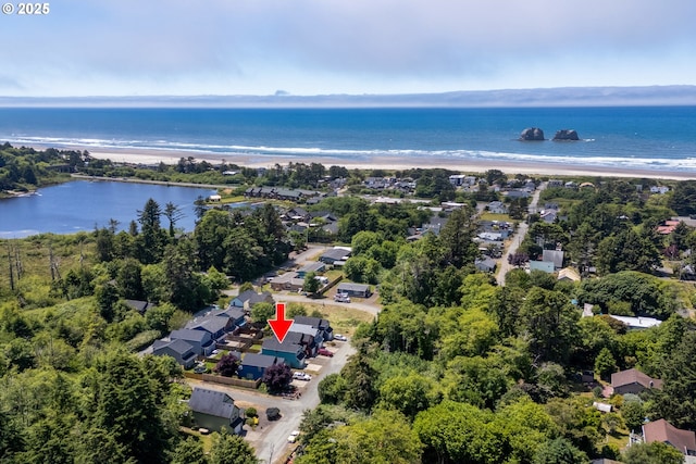 8465 S Hollyhock St, Rockaway Beach, OR 97136 - aerial view of property's location featuring waterfront with a beach