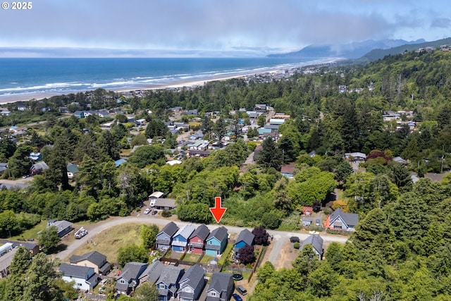 8465 S Hollyhock St, Rockaway Beach, OR 97136 - aerial view of property's location with waterfront with a beach and nearby suburban area
