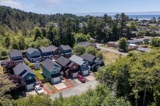 8465 S Hollyhock St, Rockaway Beach, OR 97136 - aerial view of residential area featuring a heavily wooded area and property boundaries highlighted