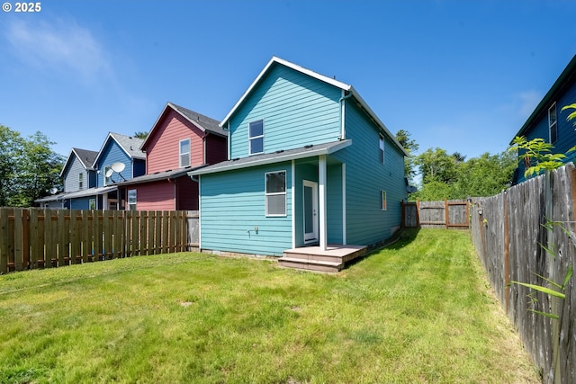 8465 S Hollyhock St, Rockaway Beach, OR 97136 - rear view of property with a fenced backyard