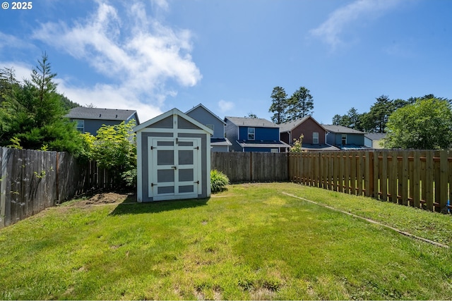 8465 S Hollyhock St, Rockaway Beach, OR 97136 - fenced backyard featuring a shed and a residential view