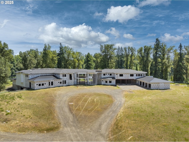 32088 SW Peach Cove Rd, West Linn, OR 97068 - view of front of home featuring a front lawn, dirt driveway, and stone siding