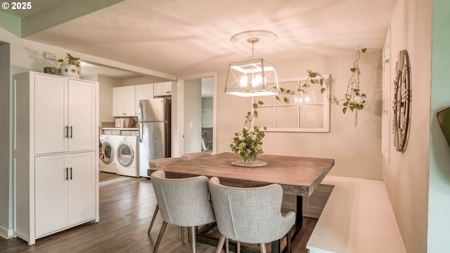 dining room with a chandelier, dark wood-style flooring, and independent washer and dryer