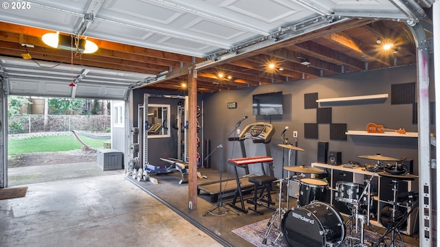 garage featuring a garage door opener and electric panel