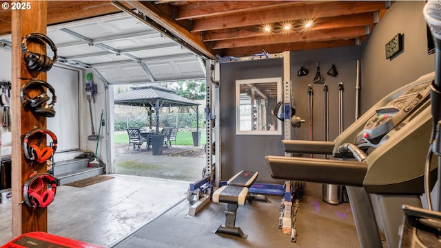 workout area with a garage