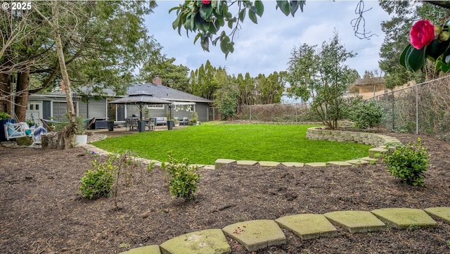 view of yard with a gazebo, a patio area, and a fenced backyard