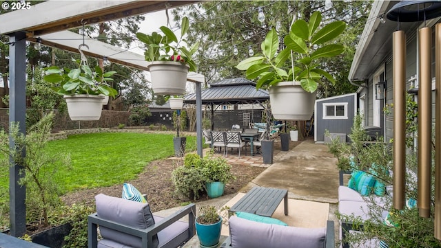 view of patio / terrace with a gazebo and fence