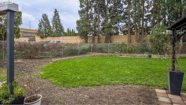 view of yard with a fenced backyard