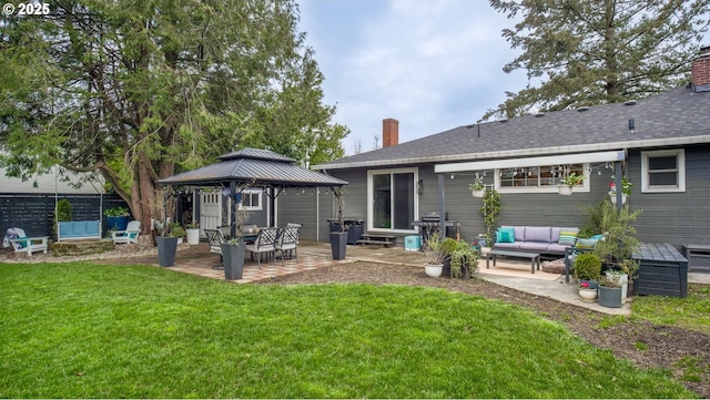 back of house with a yard, a chimney, a patio, and a gazebo