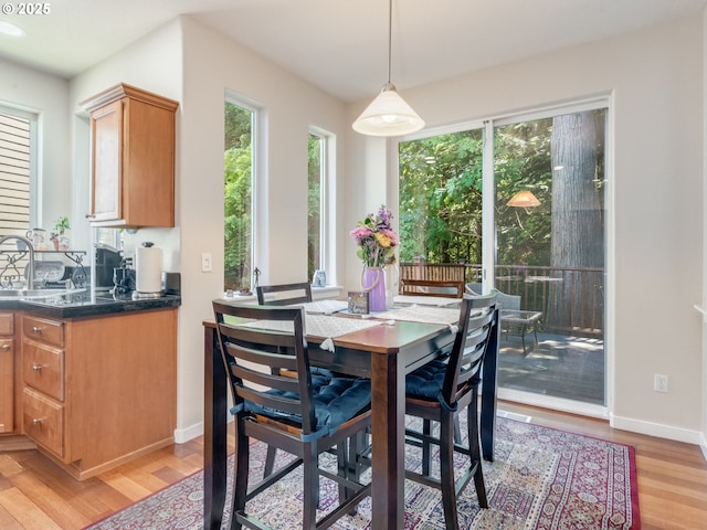21390 SW Roellich Ave, Sherwood, OR 97140 - dining area featuring light wood finished floors and baseboards
