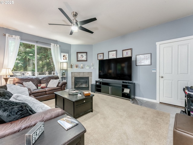 21390 SW Roellich Ave, Sherwood, OR 97140 - living room with ceiling fan, light colored carpet, a tile fireplace, and baseboards