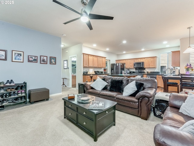 21390 SW Roellich Ave, Sherwood, OR 97140 - living area featuring light carpet, ceiling fan, and recessed lighting