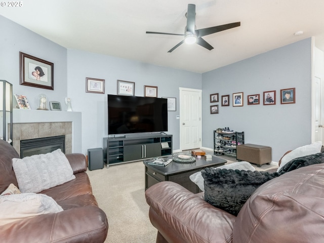 21390 SW Roellich Ave, Sherwood, OR 97140 - living room featuring ceiling fan, carpet floors, a tile fireplace, and baseboards