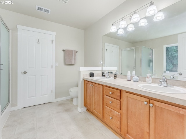21390 SW Roellich Ave, Sherwood, OR 97140 - bathroom with a stall shower, double vanity, baseboards, and toilet