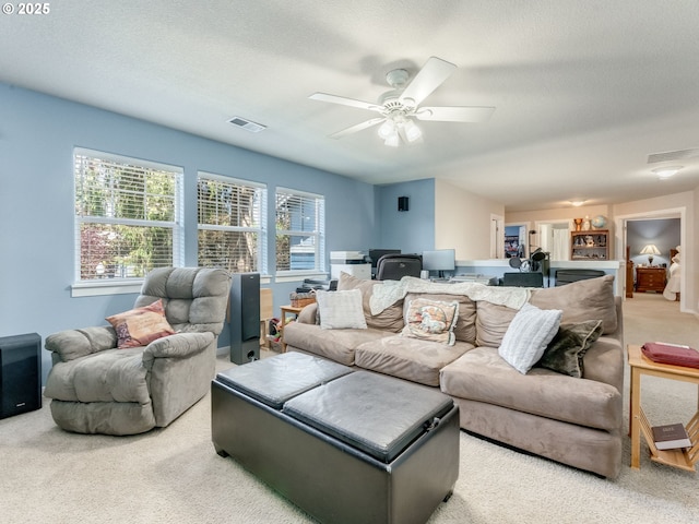21390 SW Roellich Ave, Sherwood, OR 97140 - living room with carpet, a textured ceiling, and ceiling fan