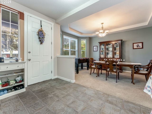 21390 SW Roellich Ave, Sherwood, OR 97140 - carpeted entrance foyer featuring a chandelier, a tray ceiling, baseboards, and stone finish floors