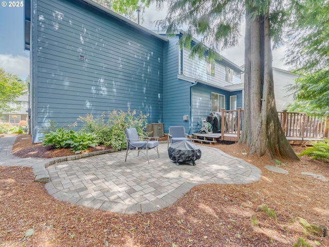 21390 SW Roellich Ave, Sherwood, OR 97140 - back of property with a patio, an outdoor fire pit, and a deck