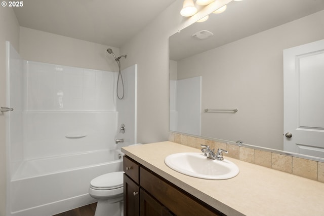 full bathroom featuring bathing tub / shower combination, visible vents, toilet, and vanity